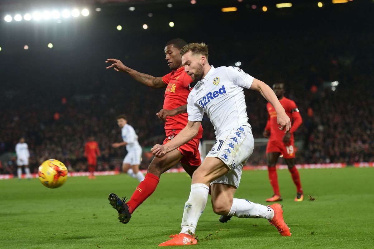 Liverpool's Dutch midfielder Georginio Wijnaldum (L) vies with Leeds United's English defender Charlie Taylor during the EFL (English Football League) Cup quarter-final football match between Liverpool and Leeds United at Anfield in Liverpool, north west England on November 29, 2016. / AFP / Paul ELLIS / RESTRICTED TO EDITORIAL USE. No use with unauthorized audio, video, data, fixture lists, club/league logos or 'live' services. Online in-match use limited to 75 images, no video emulation. No use in betting, games or single club/league/player publications.  /         (Photo credit should read PAUL ELLIS/AFP/Getty Images)