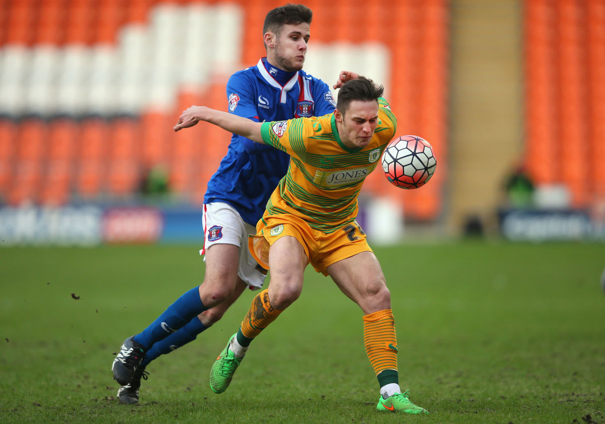 BLACKPOOL, ENGLAND - JANUARY 10:  Connor Roberts of Yeovil Town holds off a challenge from Macaulay Gillesphey of Carlisle United during The Emirates FA Cup Third Round match between Carlisle United and Yeovil Town at Bloomfield Road on January 10, 2016 in Blackpool, England.  (Photo by Alex Livesey/Getty Images)