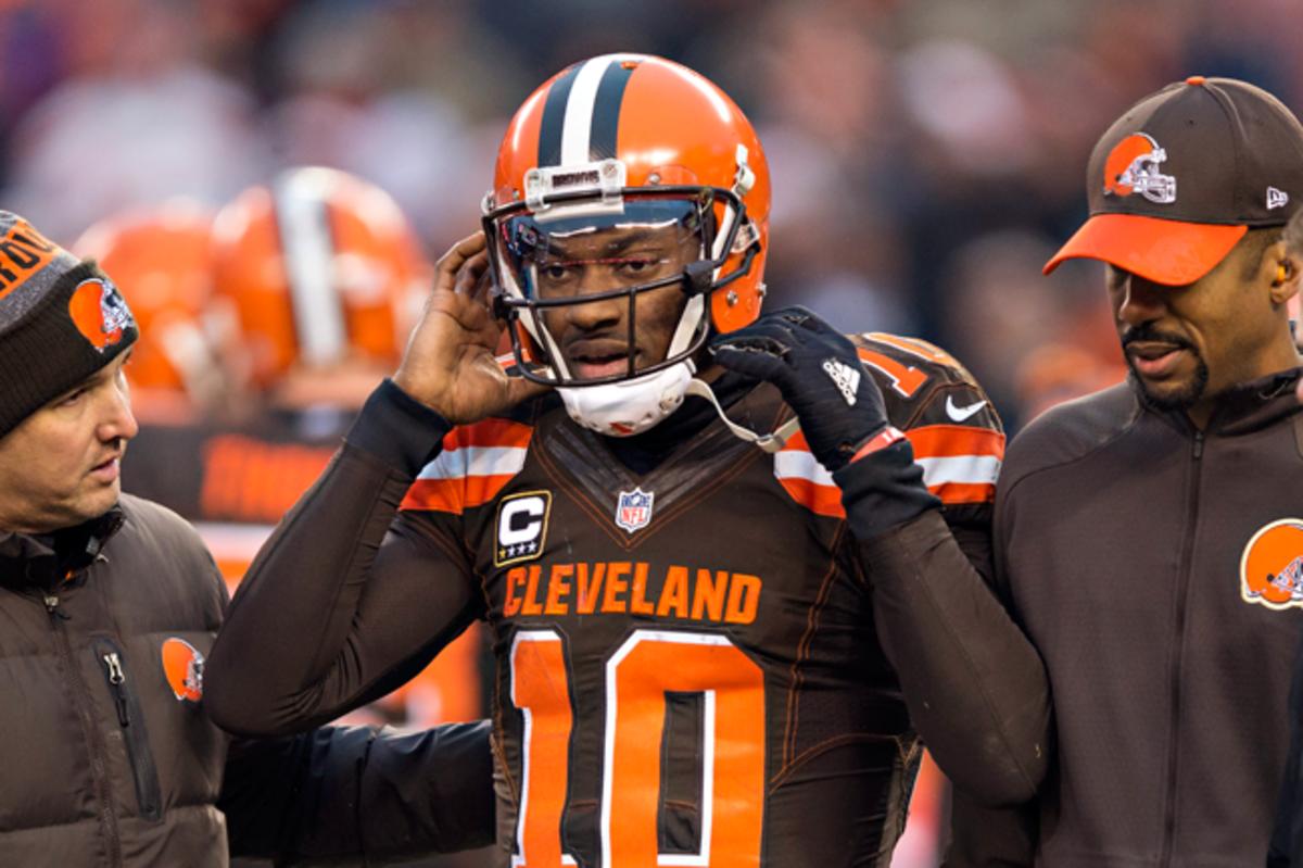 Robert Griffin III is helped off the field after suffering a concussion last December.