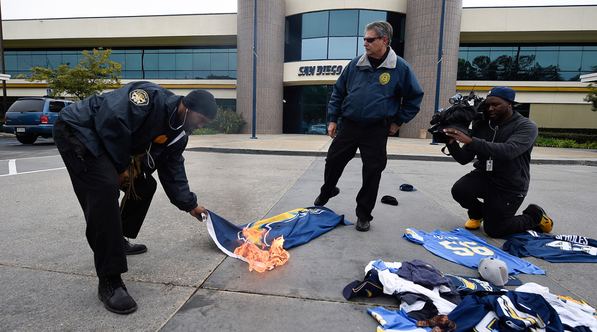 San Diego Chargers fans set fire to team merchandise after the franchise moved to Los Angeles.