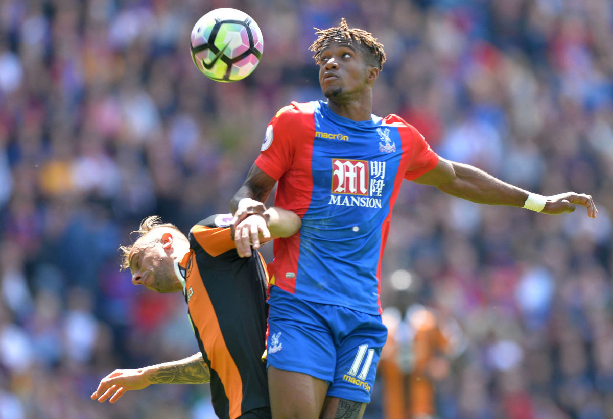 Crystal Palace's Ivorian striker Wilfried Zaha vies with Hull City's Polish midfielder Kamil Grosicki during the English Premier League football match between Crystal Palace and Hull City at Selhurst Park in south London on May 14, 2017 / AFP PHOTO / OLLY GREENWOOD / RESTRICTED TO EDITORIAL USE. No use with unauthorized audio, video, data, fixture lists, club/league logos or 'live' services. Online in-match use limited to 75 images, no video emulation. No use in betting, games or single club/league/player publications.  /         (Photo credit should read OLLY GREENWOOD/AFP/Getty Images)
