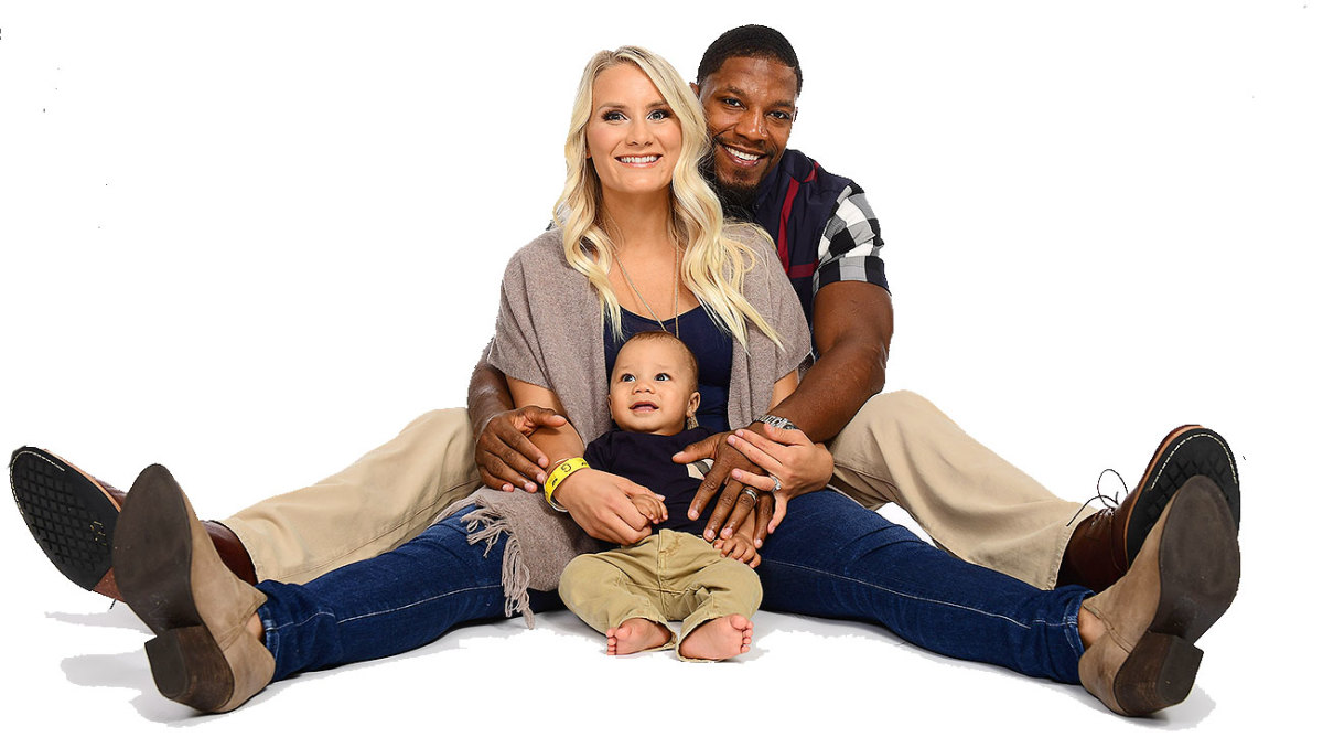 David Johnson poses with his wife Meghan and son David Jr.