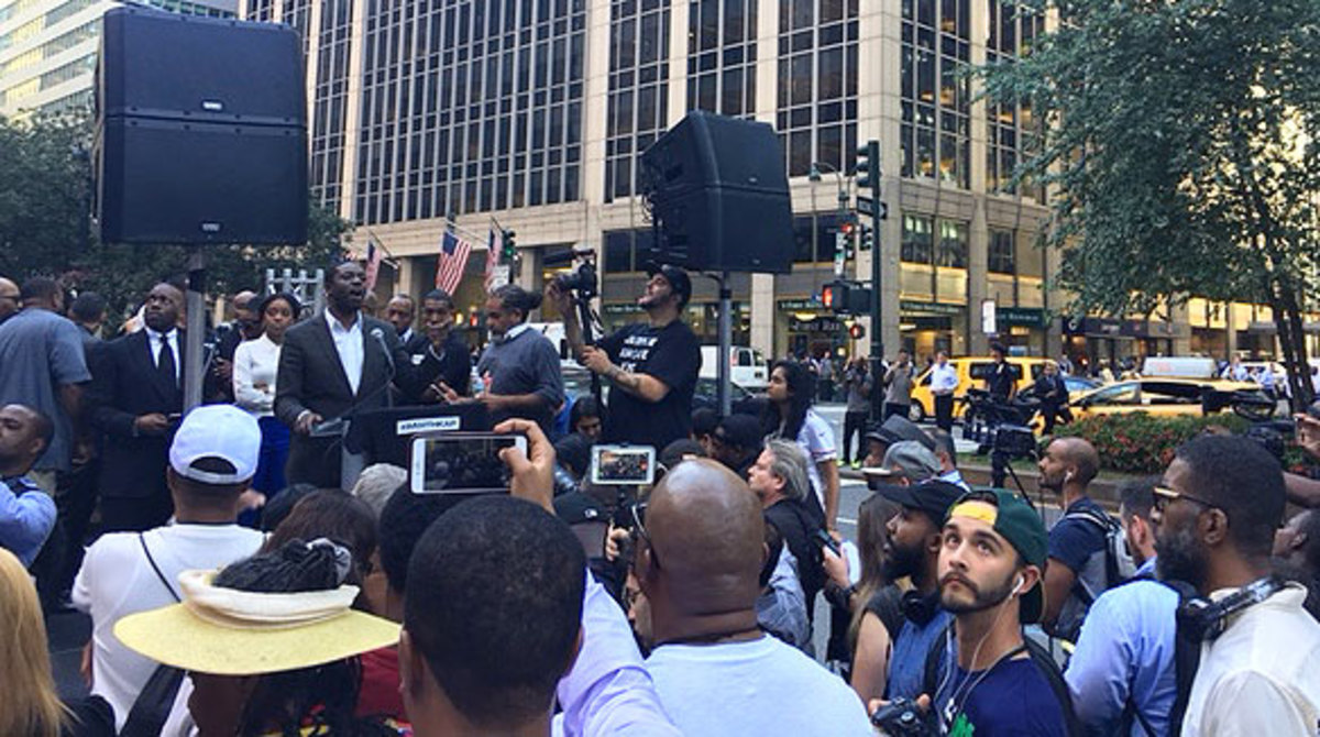 Stephen Green, the president of The People’s Consortium for Human and Civil Rights, delivers his speech in front of the NFL offices.