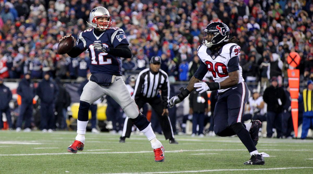 Tom Brady looks to throw with Jadeveon Clowney bearing down on him in last Sunday’s AFC divisional game.