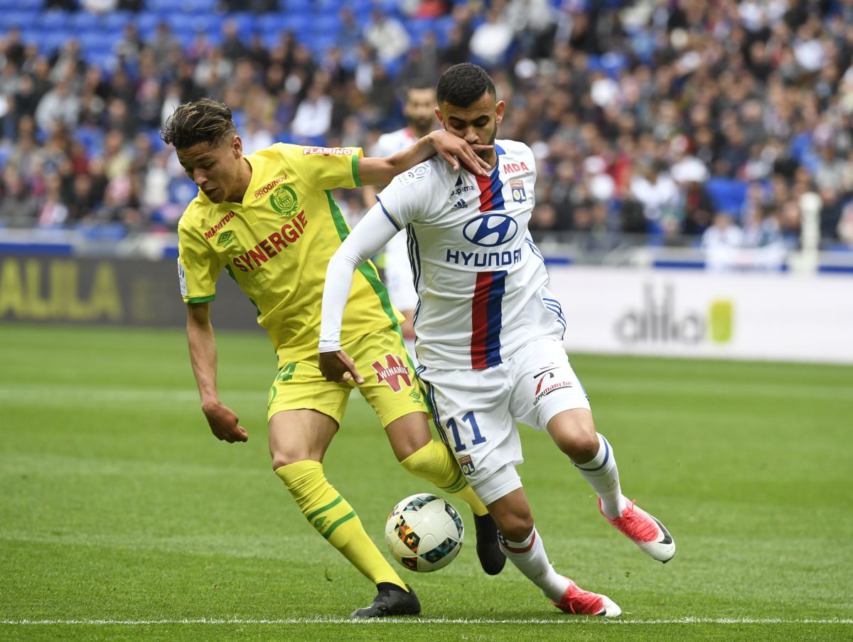 Nantes' French midfielder Amine Harit (L) challenges Lyon's French-Algerian midfielder Rachid Ghezzal (R) during the French L1 football match between Lyon and Nantes at the Parc Olympique Lyonnais stadium in Decines-Charpieu near Lyon, southeastern France, on May 7, 2017. / AFP PHOTO / PHILIPPE DESMAZES (Photo credit should read PHILIPPE DESMAZES/AFP/Getty Images)