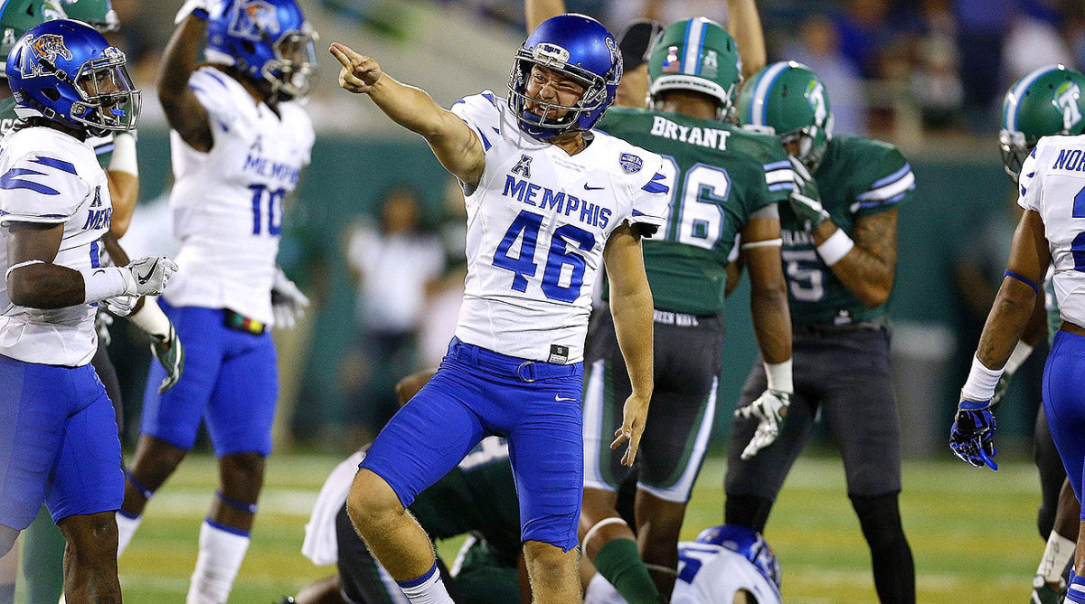 Memphis placekicker Jake Elliott celebrates after a successful onside kick against Tulane.