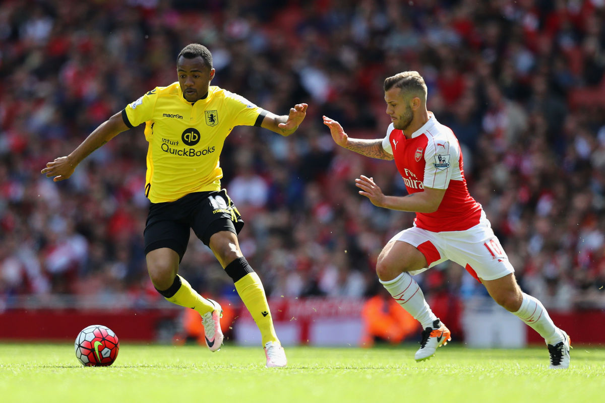 LONDON, ENGLAND - MAY 15:  Jordan Ayew of Aston Villa holds off Jack Wilshere of Arsenal during the Barclays Premier League match between Arsenal and Aston Villa at the Emirates Stadium on May 15, 2016 in London, England.  (Photo by Julian Finney/Getty Images)
