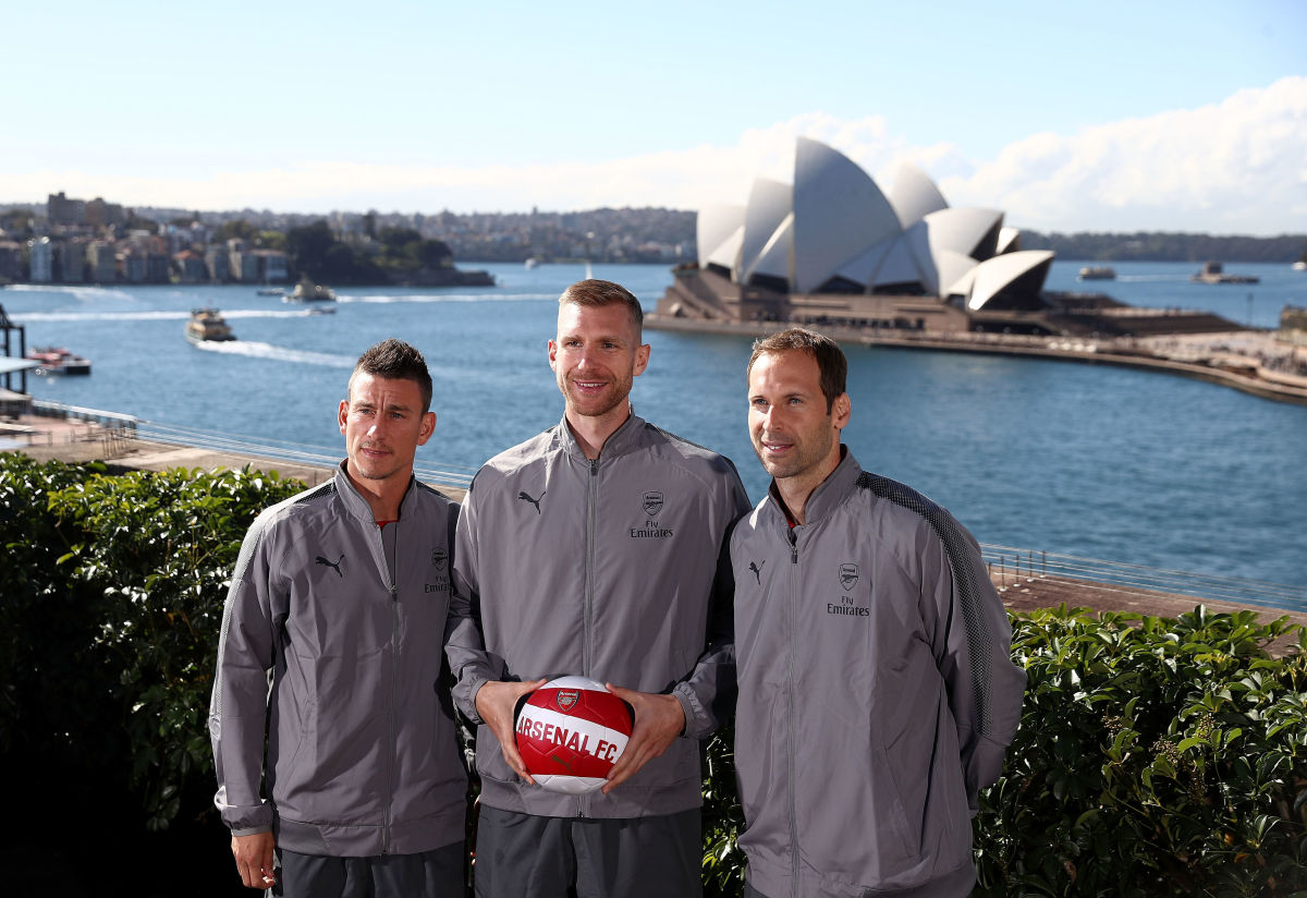 SYDNEY, AUSTRALIA - JULY 11: (L-R) Laurent Koscielny, Per Mertesacker and Petr Cech pose in front of the Sydney Opera House during an Official Welcome to Sydney for Arsenal FC at Museum of Contemporary Art on July 11, 2017 in Sydney, Australia.  (Photo by Ryan Pierse/Getty Images)
