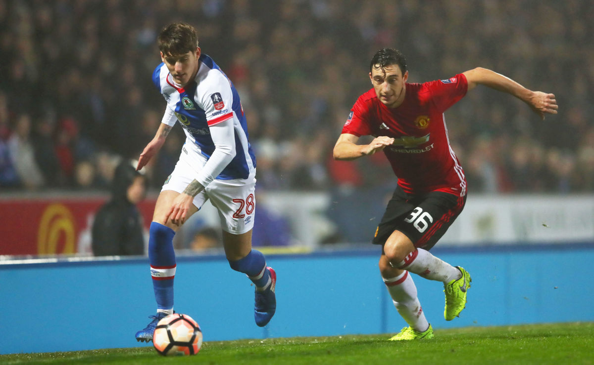 BLACKBURN, ENGLAND - FEBRUARY 19:  Connor Mahoney of Blackburn Rovers is chased by Matteo Darmian of Manchester United during The Emirates FA Cup Fifth Round match between Blackburn Rovers and Manchester United at Ewood Park on February 19, 2017 in Blackburn, England.  (Photo by Michael Steele/Getty Images)