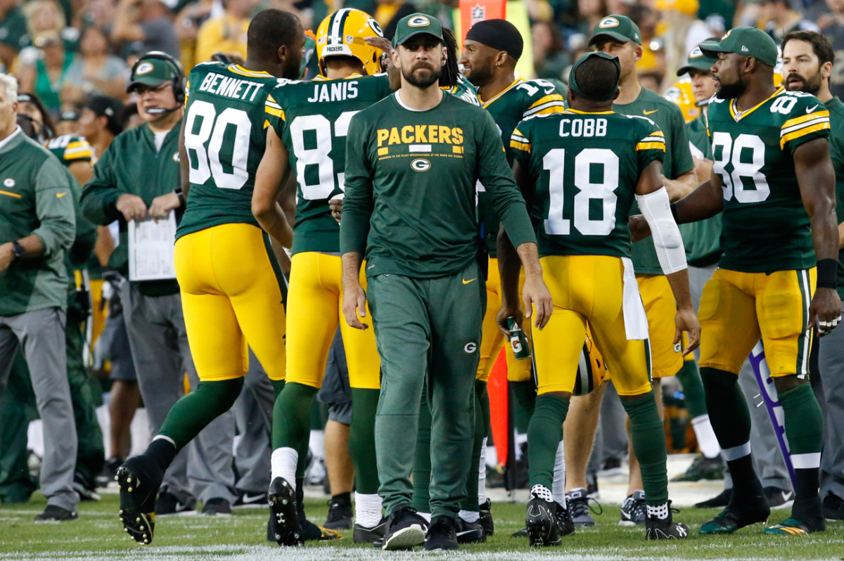 Aaron Rodgers dressed in uniform and participated in pre-game warmups but was on the sideline in street clothes for the Packers-Eagles preseason game last Thursday.