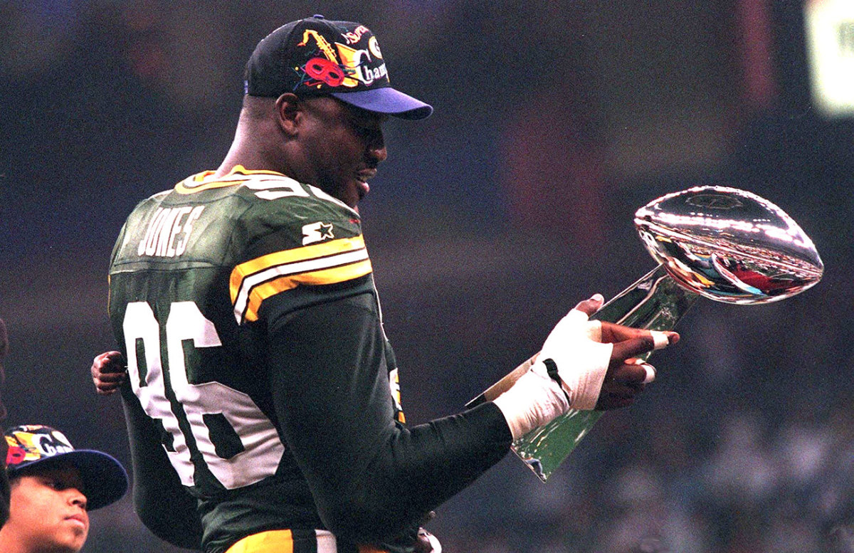 Sean Jones admires the Lombardi Trophy after Super Bowl XXXI.