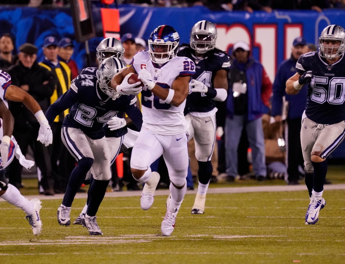 Nov 4, 2019; East Rutherford, NJ, USA; New York Giants running back Saquon Barkley (26) runs for a 65 yard 1st down ion the 4th quarter at MetLife Stadium.