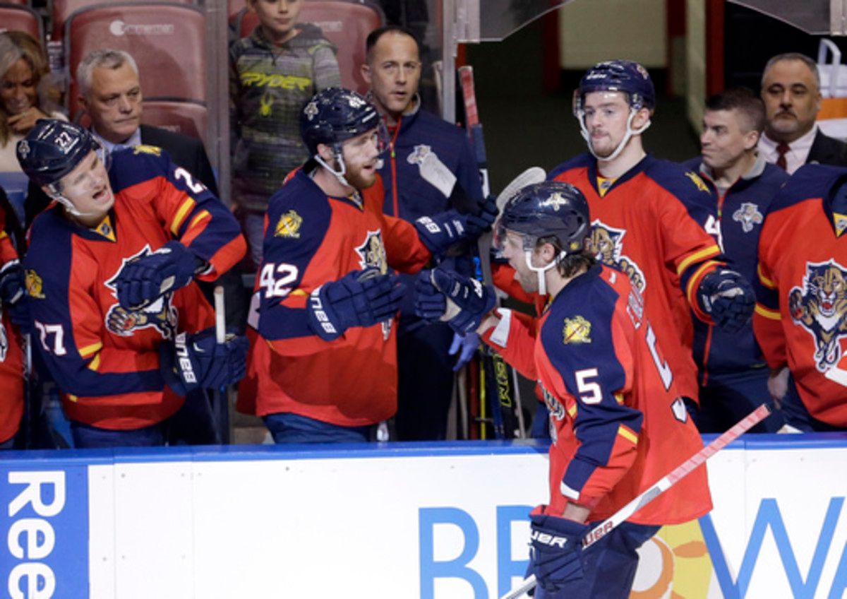 FILE - In this Jan. 22, 2016 file photo, Florida Panthers defenseman Aaron Ekblad (5) is congratulated by teammates after scoring a goal against the Chicago Blackhawks during the second period of an NHL hockey game in Sunrise, Fla. On a team with a soon-t