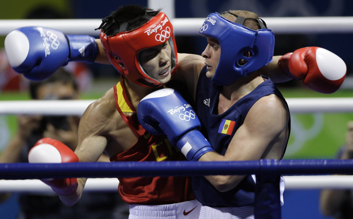 Olympic boxers to fight without headgear, worry about cuts Sports
