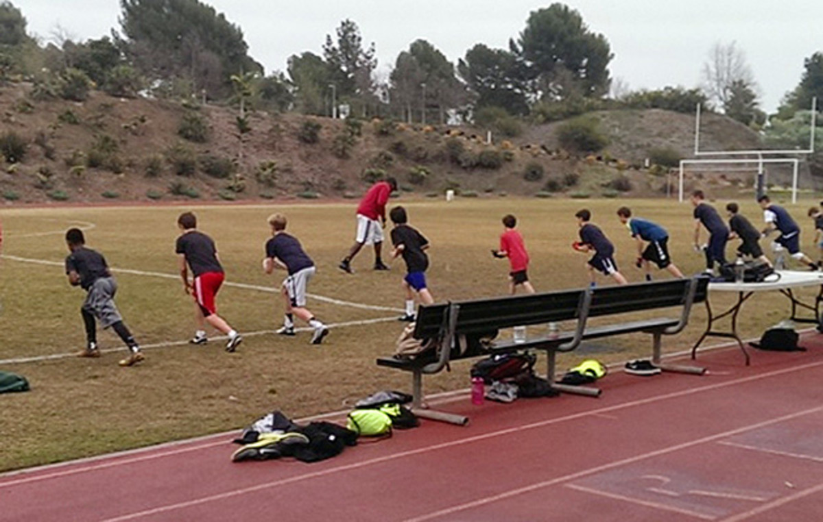Mike Williams (background, in red) leading drills at Brentwood Junior High.