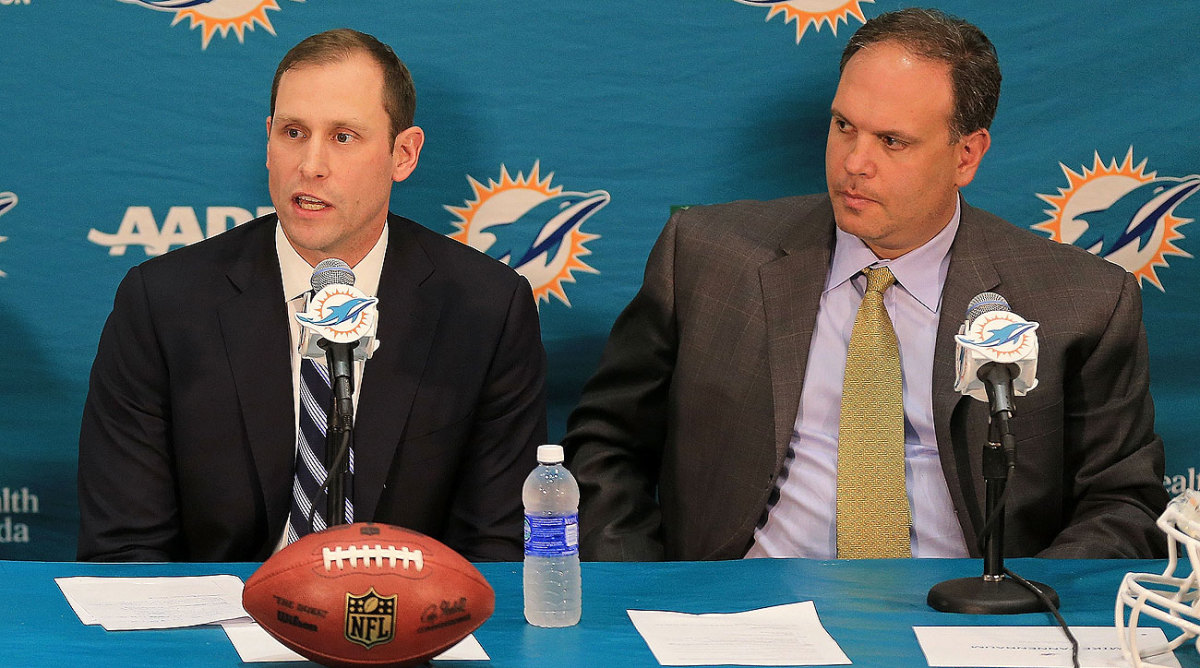 Dolphins vice president Mike Tannenbaum (right) introduced Adam Gase as the team’s new head coach on Saturday.