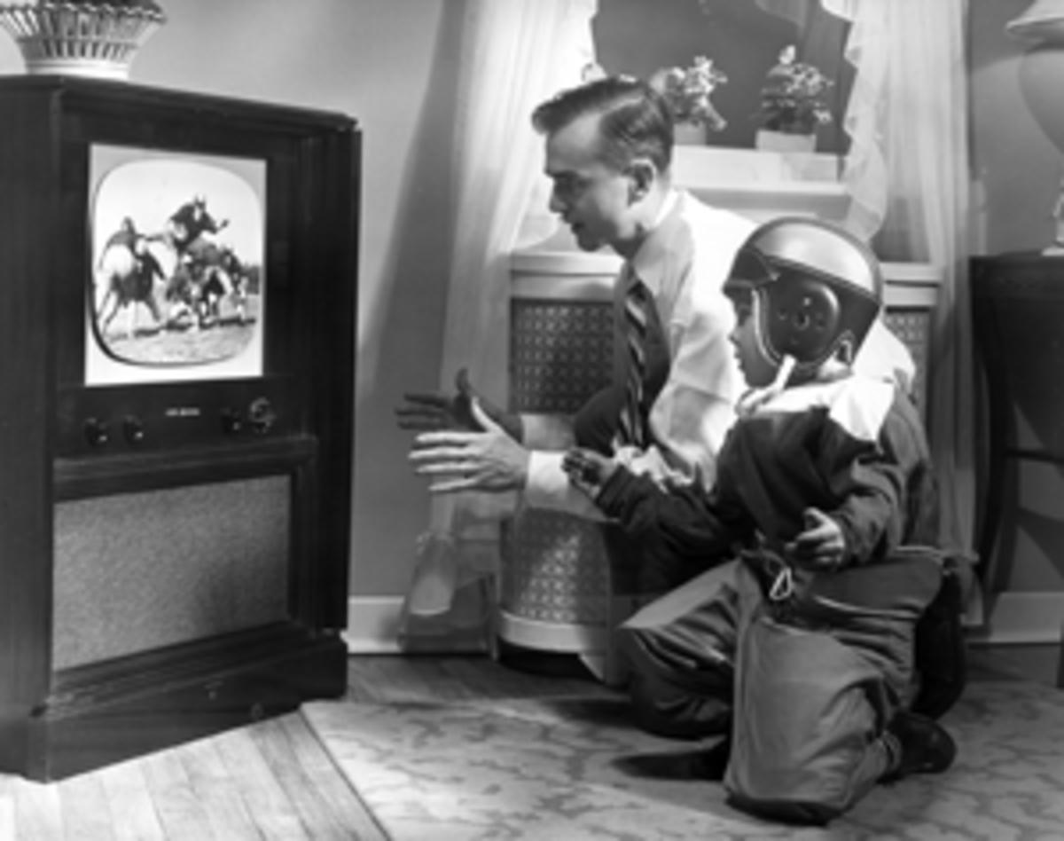 father-son-watch-football-1955-300w.png