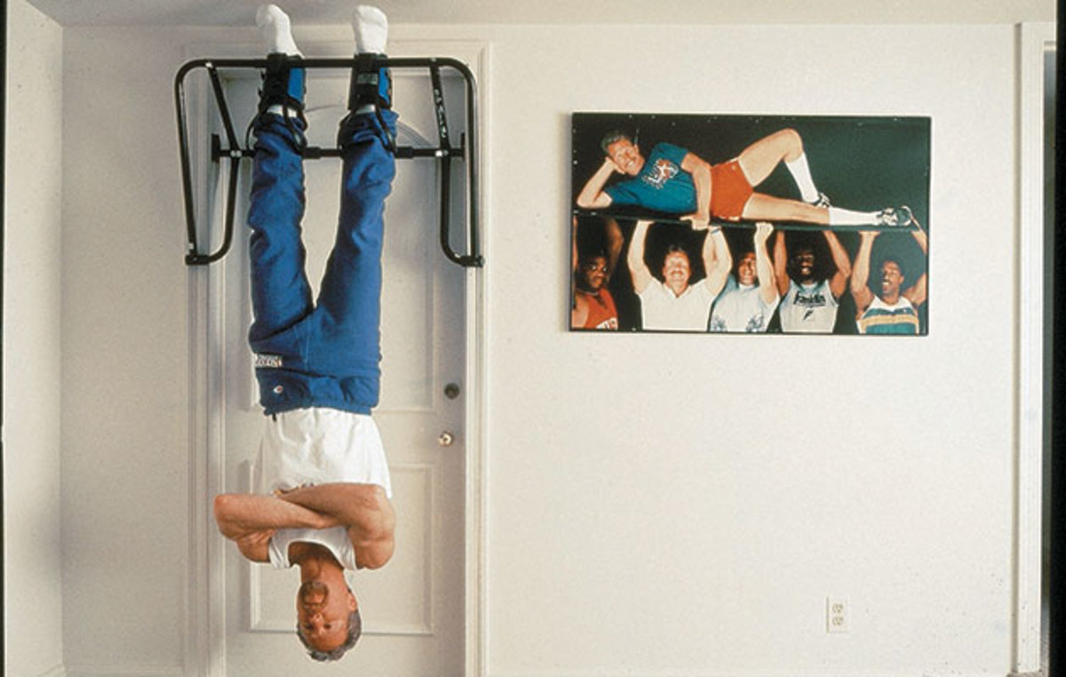 Croce hung upside down from an exercise bar next to a photo of Philadelphia sports legends for a photo within SI’s 1996 story.