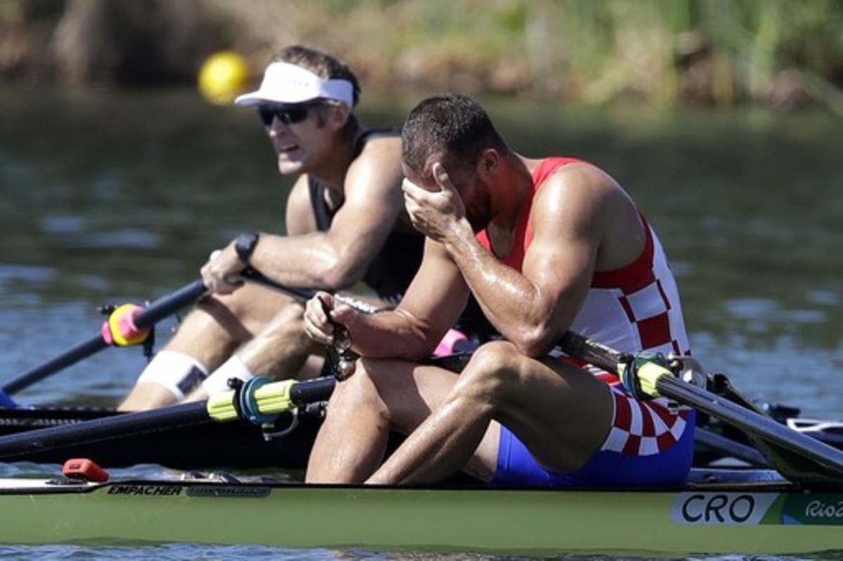 Silver medalist Damir Martin, of Croatia, right, reacts as gold medalist Mahe Drysdale, of New Zealand, rests after the men's rowing single sculls final during the 2016 Summer Olympics in Rio de Janeiro, Brazil, Saturday, Aug. 13, 2016. Martin took the si
