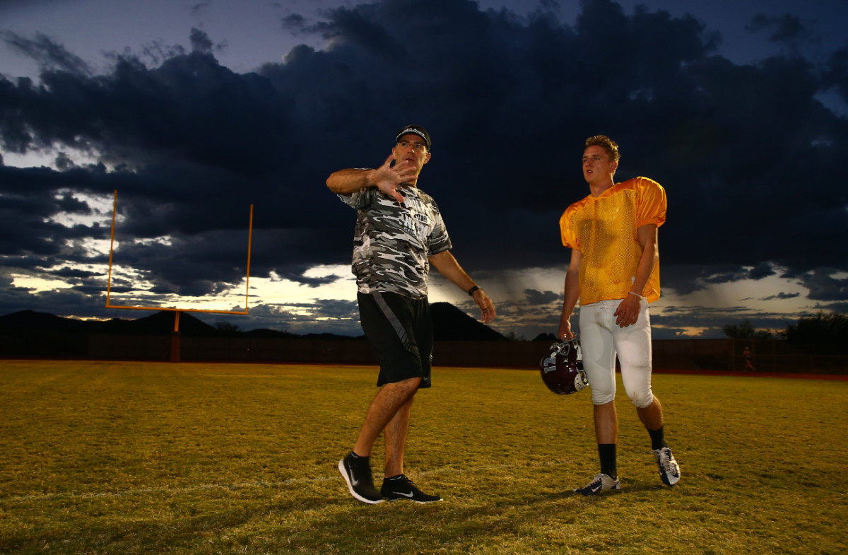 Starting QB Austin Nuessle gets some tips from his OC.