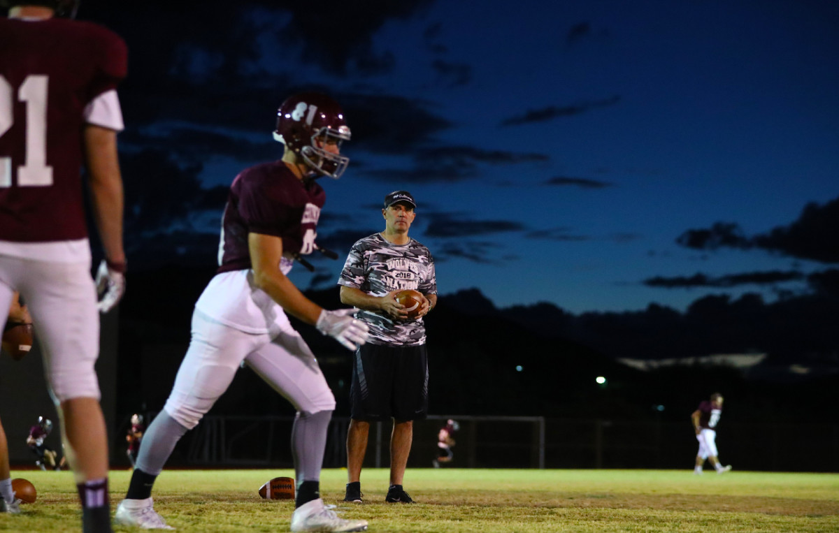 Kurt watches as son Kade prepares to run a route.
