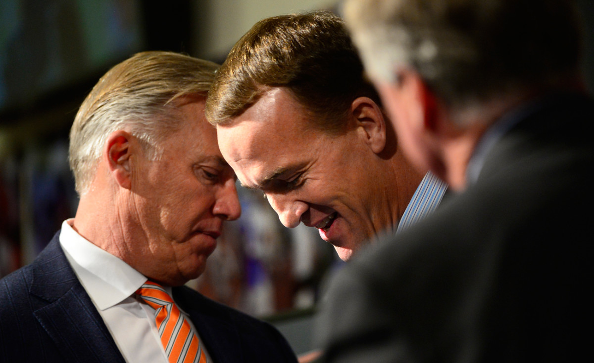 Manning with Elway, the man who brought him to Denver.
