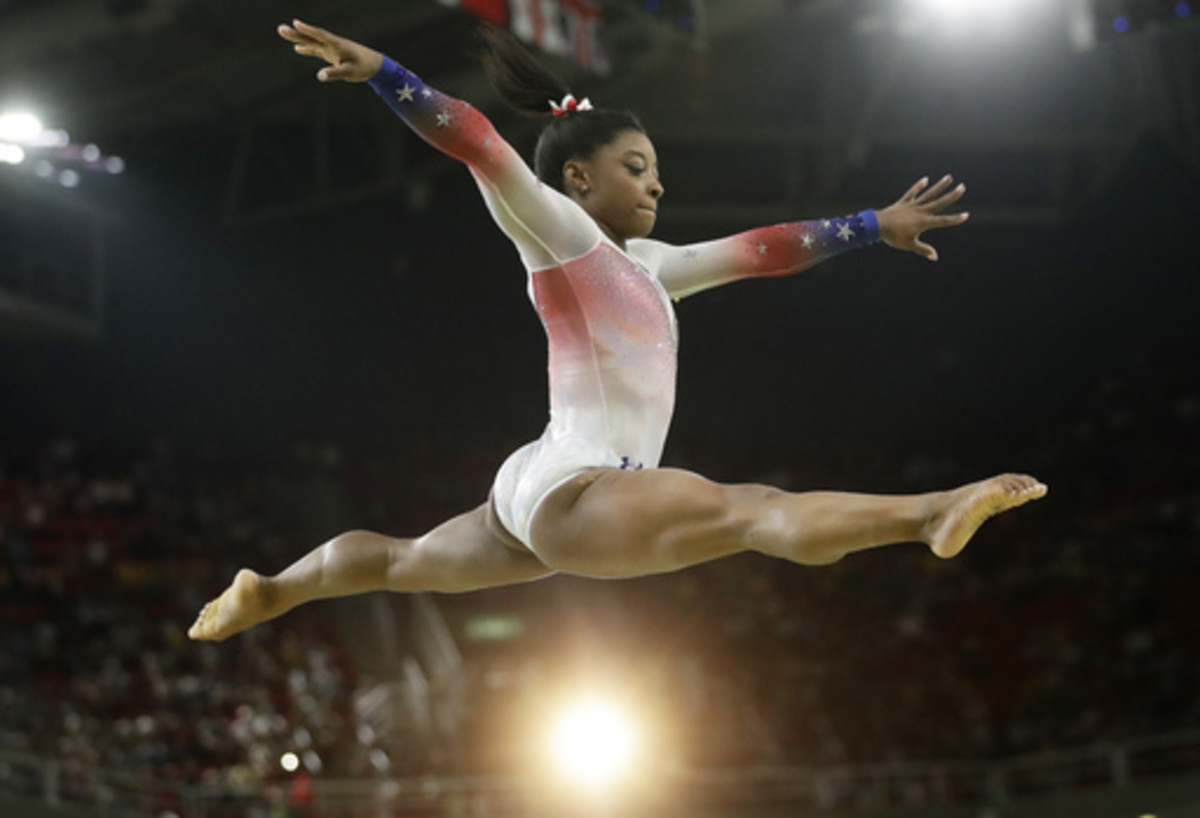 United States' Simone Biles performs on the balance beam during the gymnastics exhibition gala at the 2016 Summer Olympics in Rio de Janeiro, Brazil, Wednesday, Aug. 17, 2016. (AP Photo/Dmitri Lovetsky)