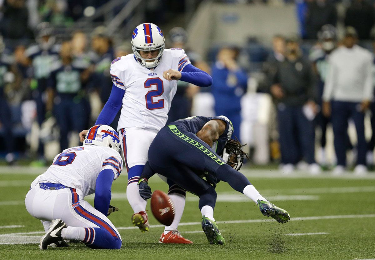 Richard Sherman barrels into Dan Carpenter on the fateful field-goal attempt.