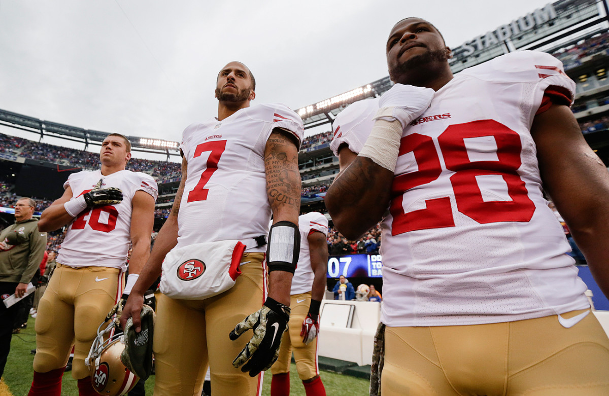As this November 2014 file photo shows, Kaepernick stood for anthems in previous seasons before deciding to make a statement in 2016.