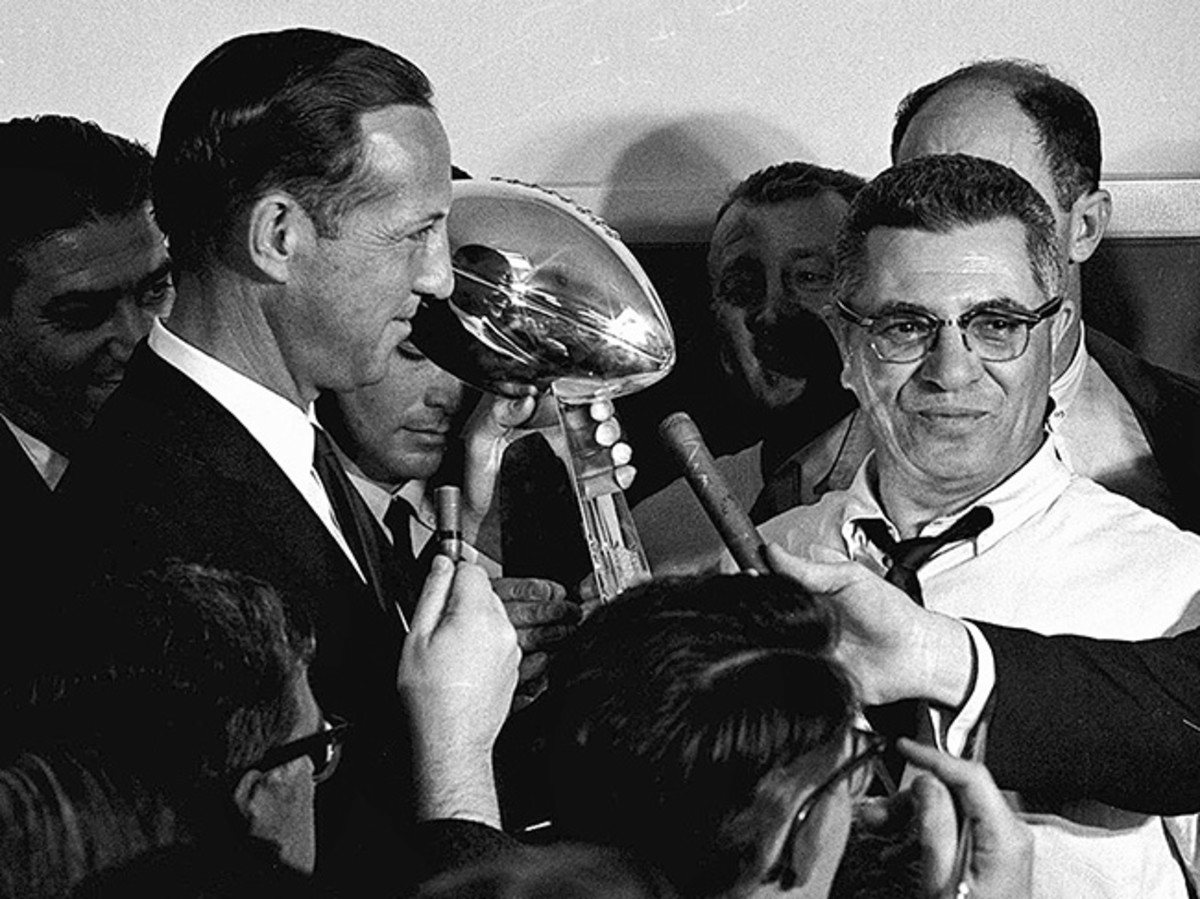When Lombardi (right) led the Packers to a Super Bowl I victory, commissioner Pete Rozelle presented him with a trophy that said “World Professional Football Championship.”