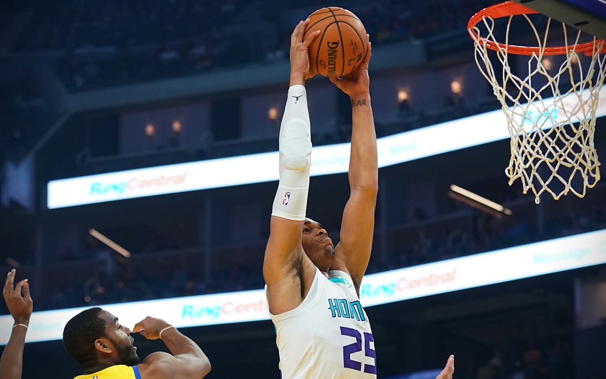 Charlotte Hornets forward PJ Washington (25) dribbles the basketball against Golden State Warriors guard Alec Burks (8) and guard Ky Bowman (12) during the first quarter at Chase Center. (Kyle Terada-USA TODAY Sports)