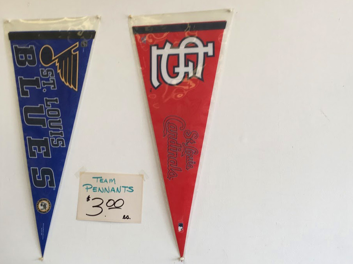 Randy Fauth only sells the pennants of two St. Louis teams in his store now.