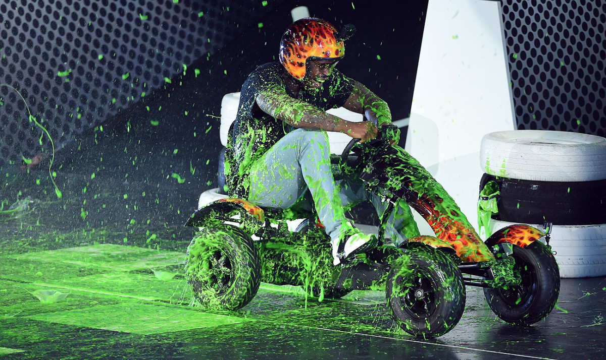 Von Miller was splashed with green twice this week: with paint at the Nickelodeon Kids Choice awards on Thursday, and with money by the Broncos on Friday.