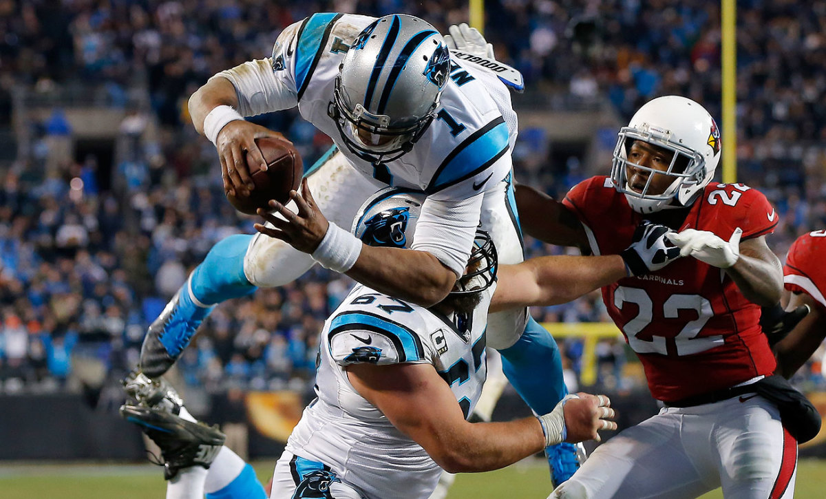 Cam Newton accounted for four touchdowns—two passing and two leaping at the goal line.