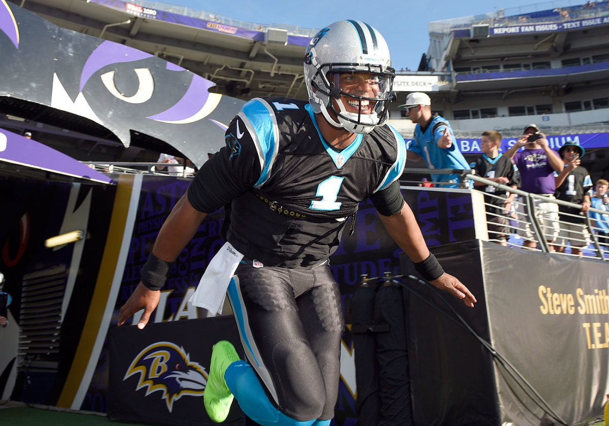 Newton makes his entry at the first preseason game, in Baltimore.