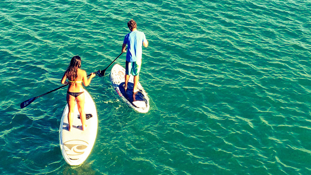 Stand up paddleboarding workout SUP exercises, fitness Sports