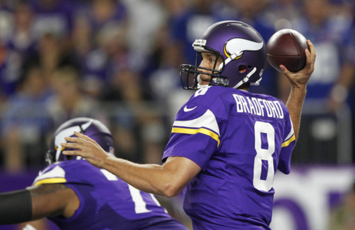FILE - In this Oct. 3, 2016, file photo, Minnesota Vikings quarterback Sam Bradford throws a pass during the first half of an NFL football game against the New York Giants, in Minneapolis.  The Houston Texans and Vikings are among the teams with the top r