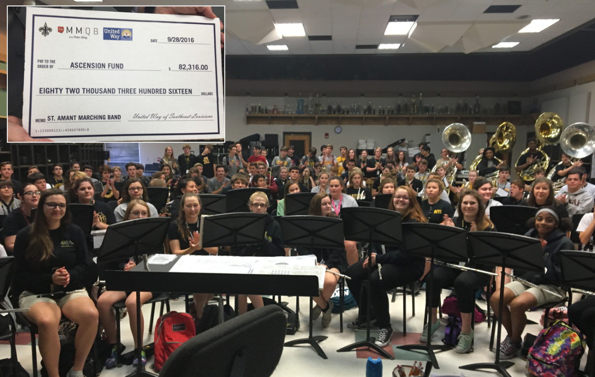 The MMQB, Saints and United Way presented the St. Amant band with a check to help replace equipment damaged by the recent floods in Louisiana.