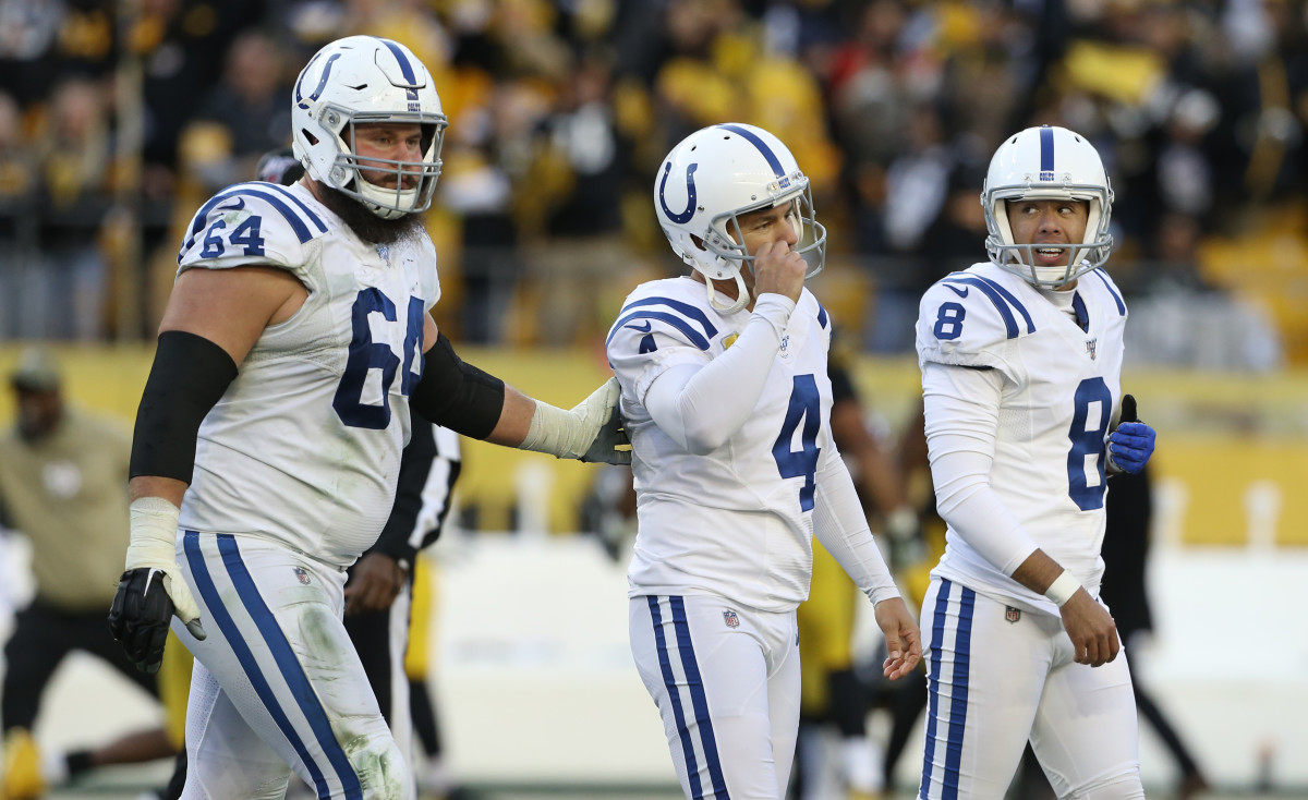 Indianapolis Colts kicker Adam Vinatieri is consoled by teammates after missing a potential game-winning field goal near the end of Sunday's 26-24 loss at Pittsburgh.
