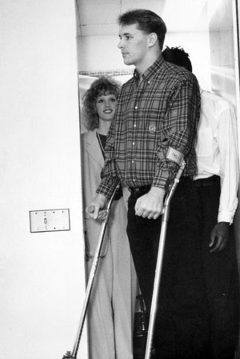 With his wife, Angela, behind him, Byrd walks into his press conference at Mount Sinai on Feb. 11, 1993.