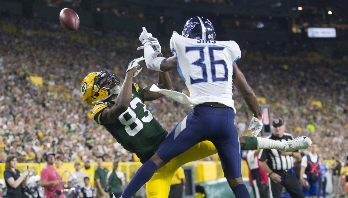 Green Bay Packers wide receiver Marquez Valdes-Scantling (83) is unable to catch a pass for a touchdown as Tennessee Titans cornerback LeShaun Sims (36) defends during the second quarter at Lambeau Field.