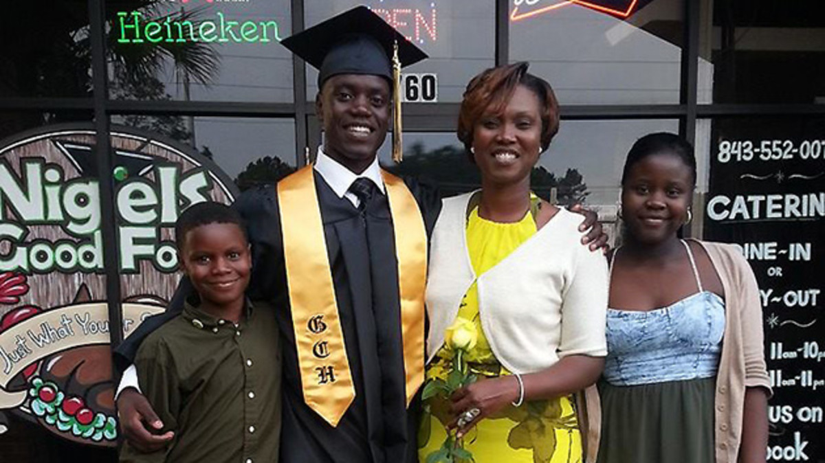 Chris celebrates high school graduation with his family. From left to right: Caleb, Chris, Sharonda and Camryn.