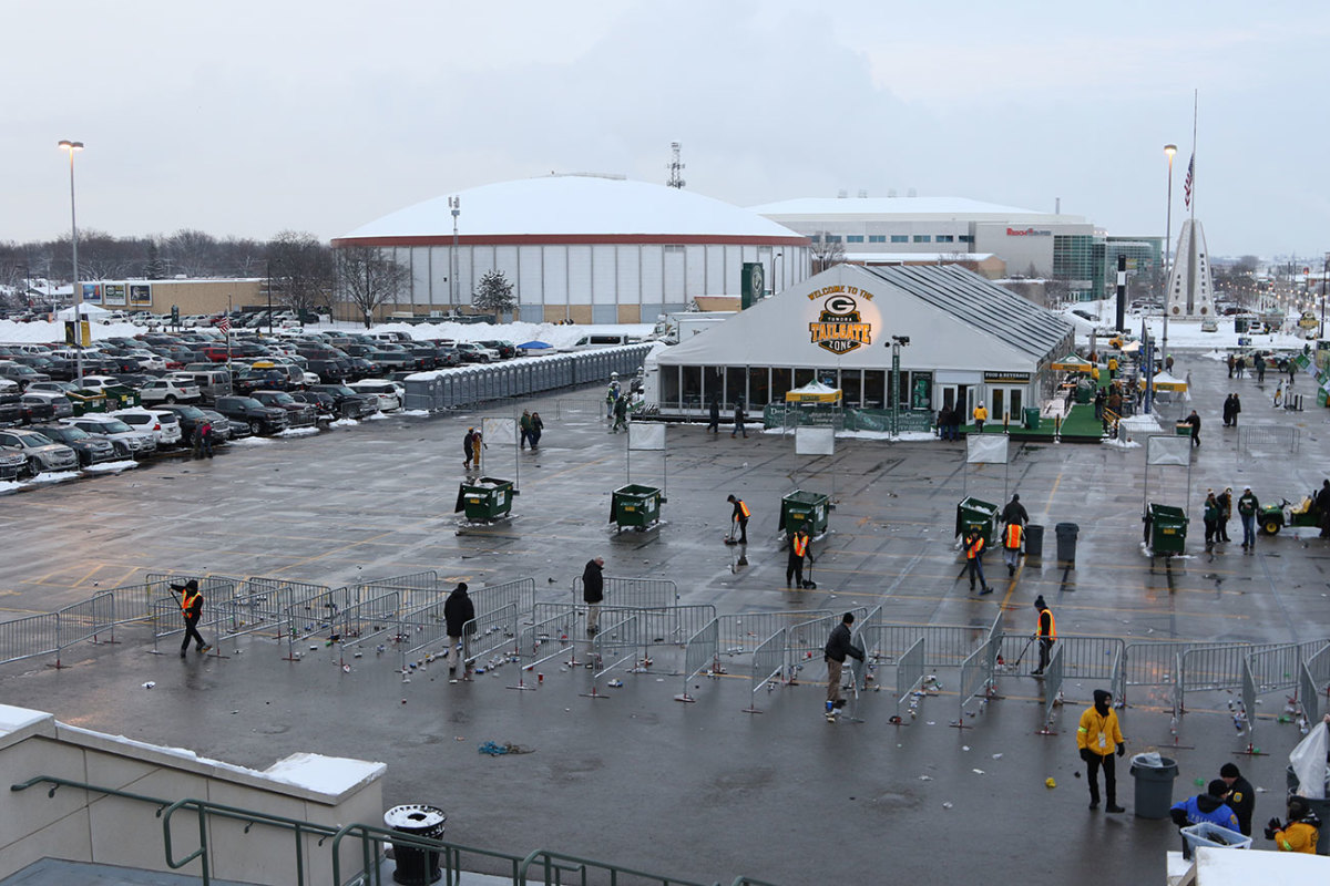 The post-pregame scene at Lambeau Field. Hmong residents volunteer at the stadium in exchange for donations to community groups.