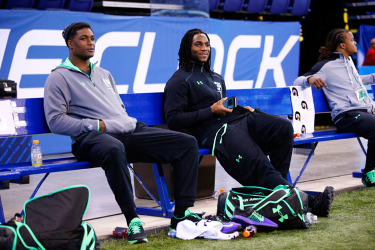 First-round talents Myles Jack (l.) and Jaylon Smith watch 2016 combine drills from the sideline while recovering from knee injuries.
