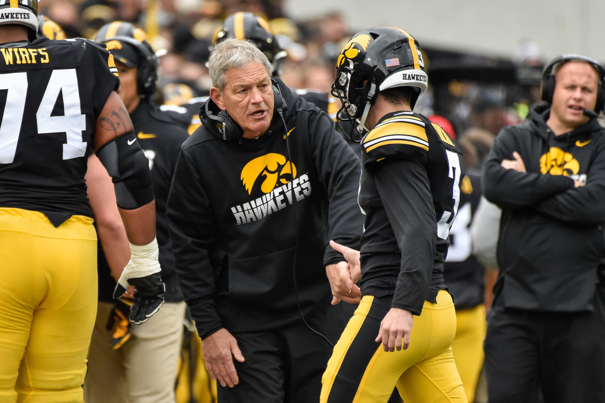 Iowa kicker Keith Duncan (3) is congratulated by coach Kirk Ferentz after one of his four field goals in the 26-20 win over Purdue.