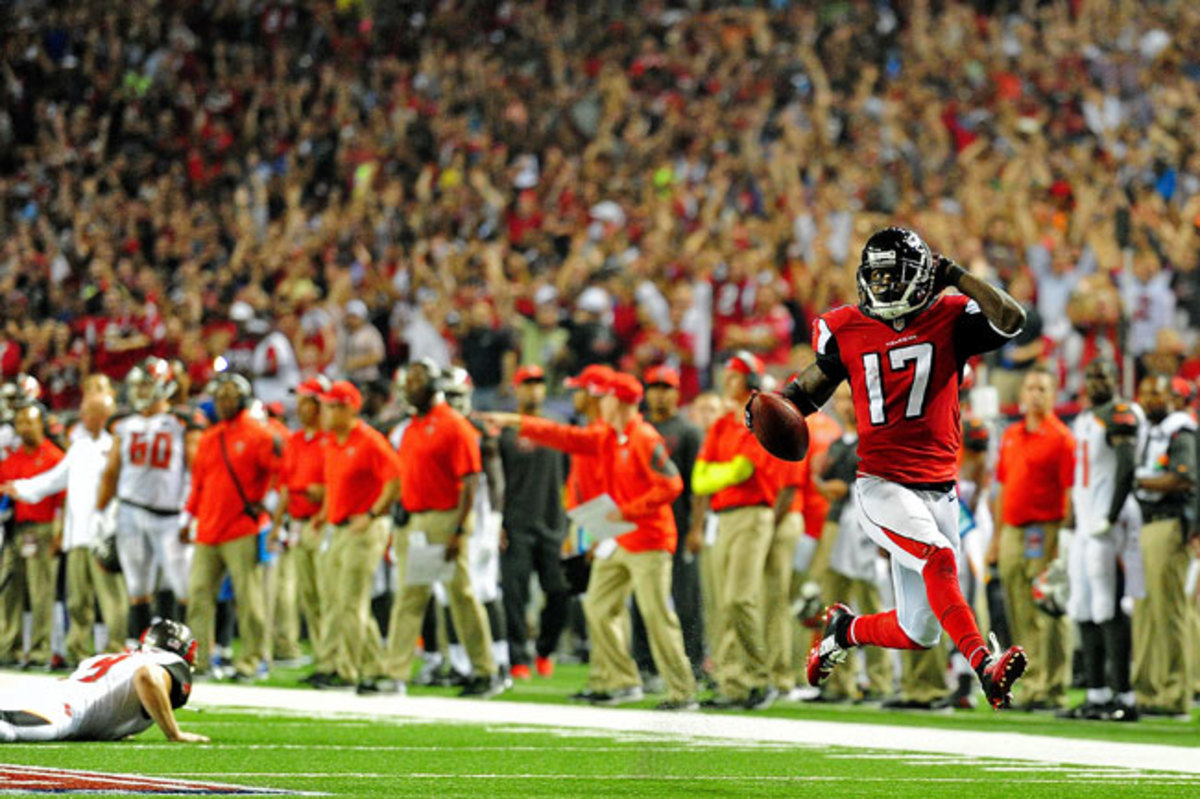 Devin Hester, shown returning a punt for a touchdown in 2014, has more combined return touchdowns (14 on punts, five on kickoffs) than anyone else in NFL history. 