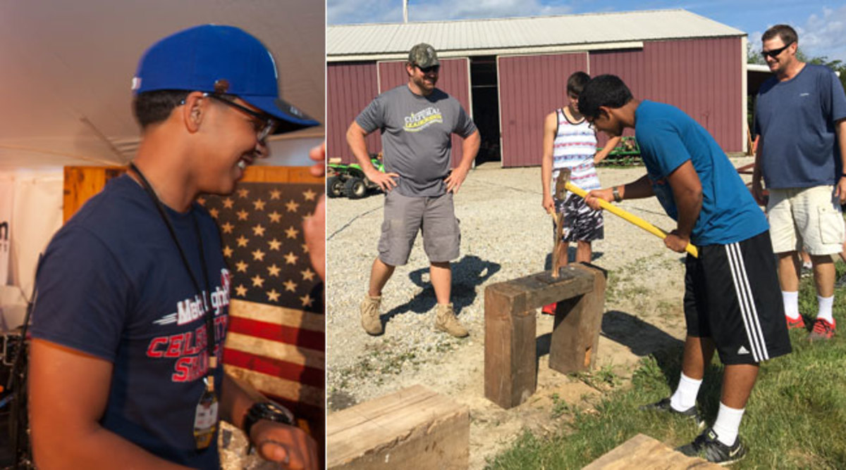Luis Matos at a camp event, and working the sledgehammer under the watchful eyes of Matt Light (hands on hips).