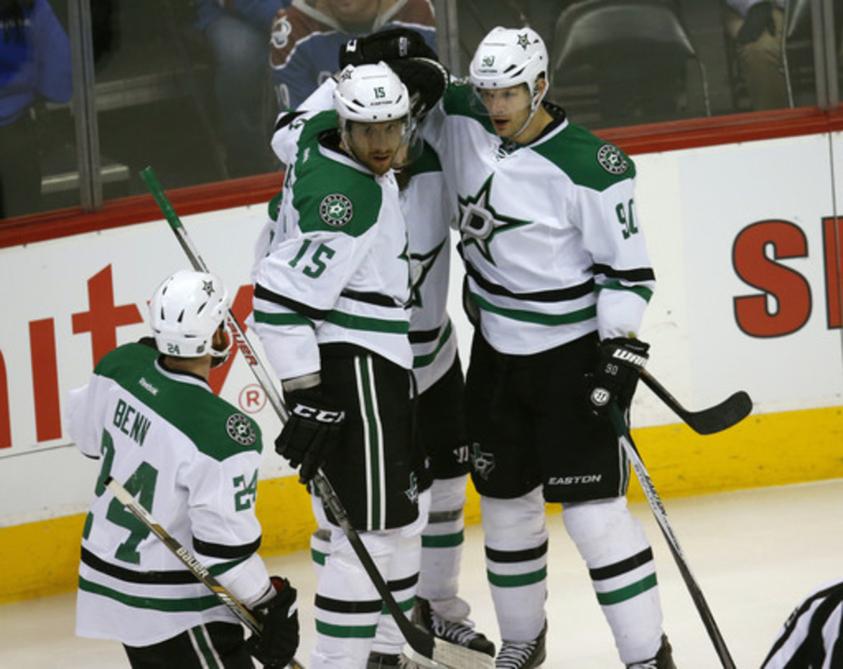 Dallas Stars center Jason Spezza, right, celebrates scoring a goal with, from left, and defensemen Jordie Benn and Patrik Nemeth, of Sweden, and right wing Patrick Eaves against the Colorado Avalanche in the first period of an NHL hockey game Thursday, Fe