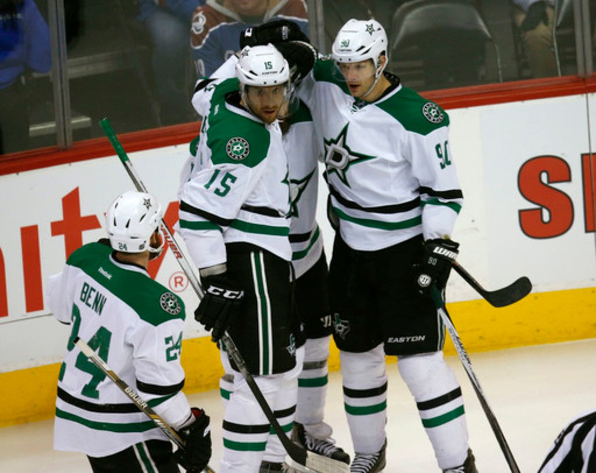 Dallas Stars center Jason Spezza, right, celebrates scoring a goal with, from left, and defensemen Jordie Benn and Patrik Nemeth, of Sweden, and right wing Patrick Eaves against the Colorado Avalanche in the first period of an NHL hockey game Thursday, Fe