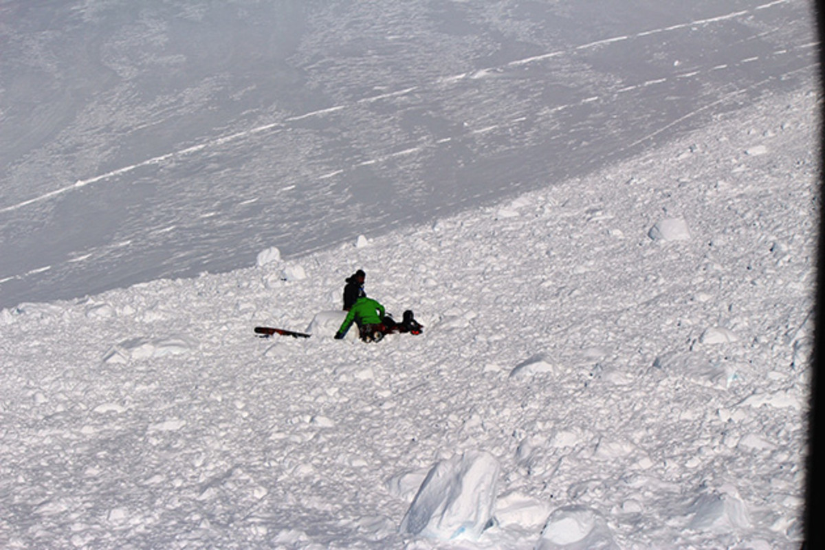 Ballinger and Suzuki tending to Gilbert.